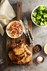 Grilled pork chops with cole slaw salad