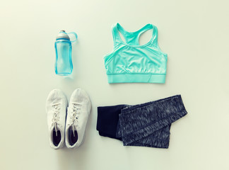 close up of female sports clothing and bottle set