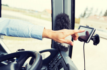 close up of bus driver driving with gps navigator