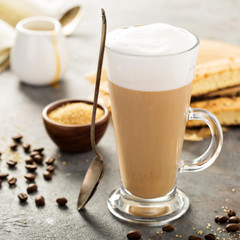Hot coffee latte with biscotti cookies