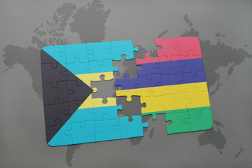 puzzle with the national flag of bahamas and mauritius on a world map