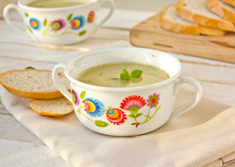 traditional polish potato soup in consomme dishes with folk ornaments