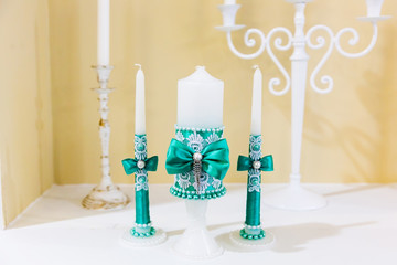 Wedding candles on restaurant table. Wedding in turquoise colors