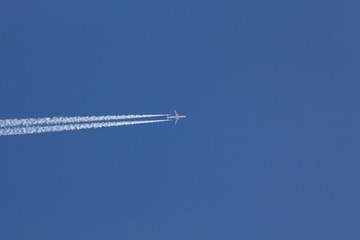 Airplane on the blue sky. 