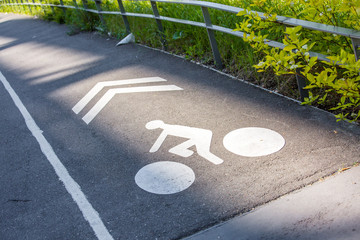 The cyclist road sign on the pavement