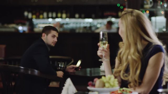 blondie flirting with a man in restaurant