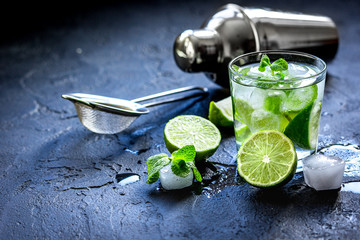 mojito in glass on dark background close up