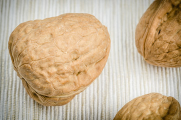 walnut on table cloth, close up