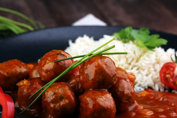 Delicious meatballs made from ground beef in a spicy tomato sauce