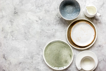 ceramic tableware top view on stone background mock up