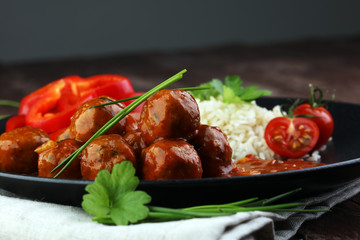 Delicious meatballs made from ground beef in a spicy tomato sauce
