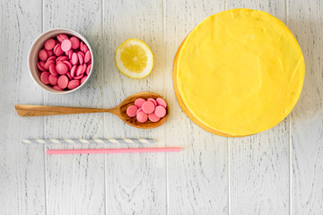 cooking lemon cake top view on wooden background