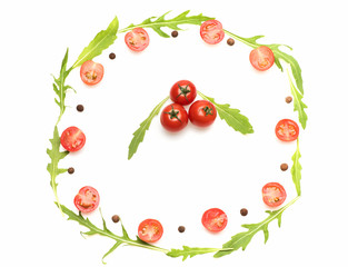 fresh vegetable, allspice, cherry tomato and arugula isolated on white