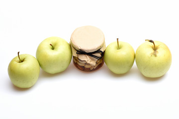 fresh green apple fruit with honey jar of nuts