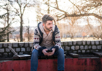 Fototapeta premium Young Man With Laptop Working 