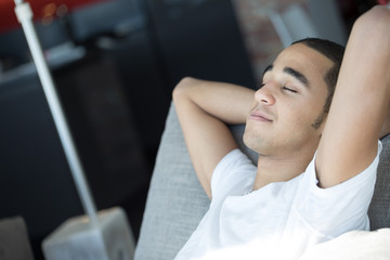 Fototapeta premium relaxed man with arms folded behind his head