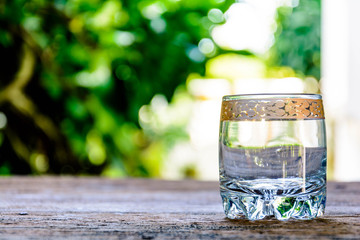 glass of water on Old wooden table