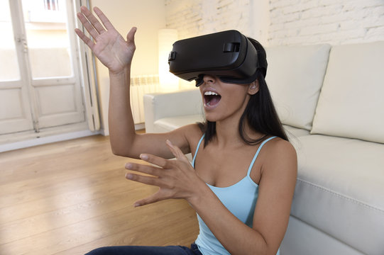 happy woman at home living room sofa couch excited using 3d goggles watching 360 virtual reality