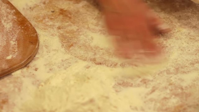 Woman working with dough. making homemade croissants