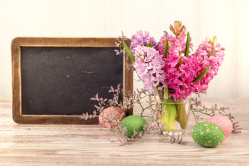 Chalk board and bunch of hyacinth blooms, text space