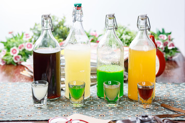 coctails in glassy bottles and glass