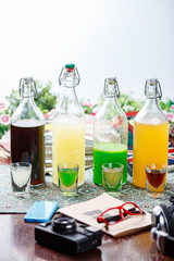coctails in glassy bottles and glass