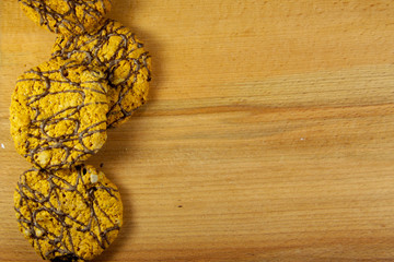 Chocolate chip cookies on wooden background