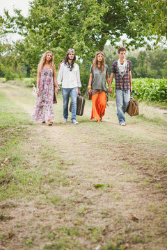 Hippies walking on a natural path