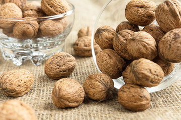 Walnuts close-up on a rustic background of burlap