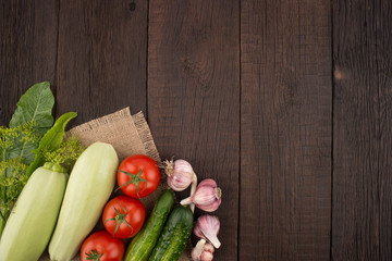 Ripe vegetables on an old wooden table.