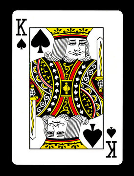 King of spades playing card, isolated on black background.