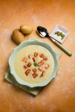 potatoes soup with roasted salmon and wasabi