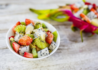 Fruit salad with dragon fruit and exotic fruits. Healthy diet and vegetarian food.
