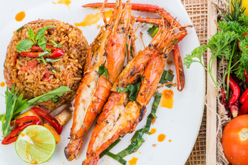 Asian fried rice nasi goreng with chicken, prawns, egg and vegetables, Thai cuisine