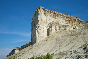 Fototapeta na wymiar At the foot of the White rock, sunny summer day. Crimea