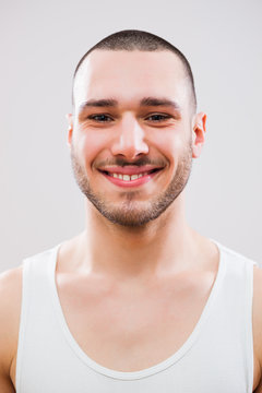 Portrait of happy young man with healthy skin on his face.