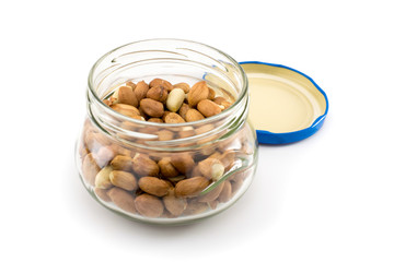 Almond nuts in glass bank isolated