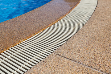 swimming pool edge with drainage ditch