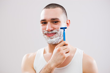 Young man is ready for shaving.
