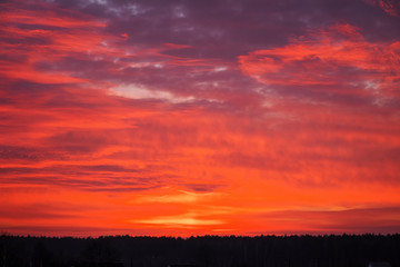 Beautiful fiery orange sky during sunset or sunrise.