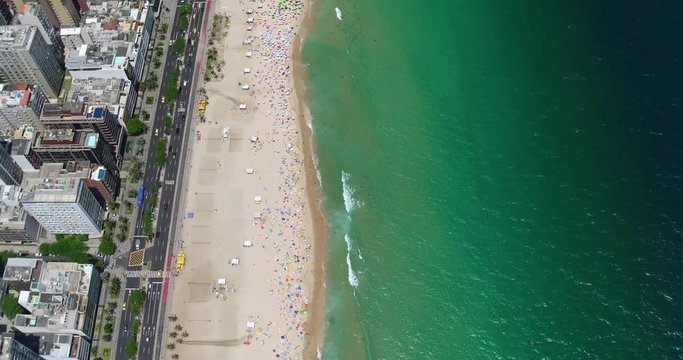 Aerial overhead view of Ipanema Beach and busy street with buildings, Rio de Janeiro, Brazil