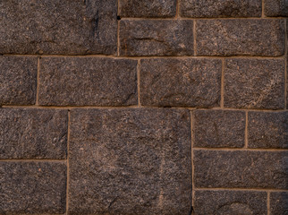 folded wall surface of the rectangular square of rough stones smooth brown