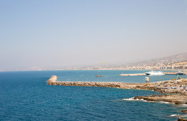 beautiful amazing views from the cliff on the blue azure sea and the port on the island of Crete in Greece