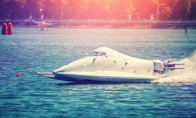   drone and  powerboat. proffesional photo and video reportage. instagram filter. creative image