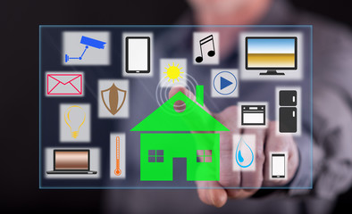 Man touching a smart home concept on a touch screen