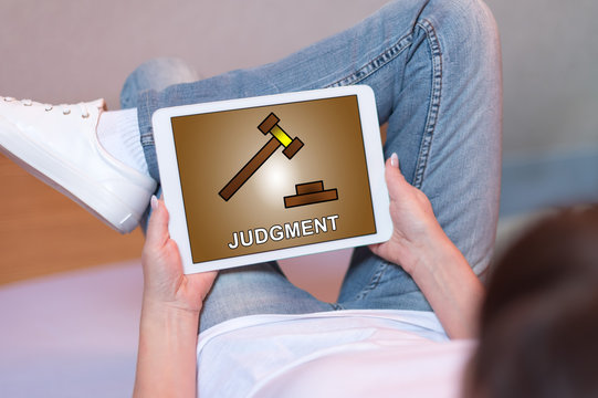 Judgment concept on a tablet