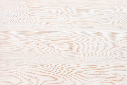 White, wooden background with a pronounced texture