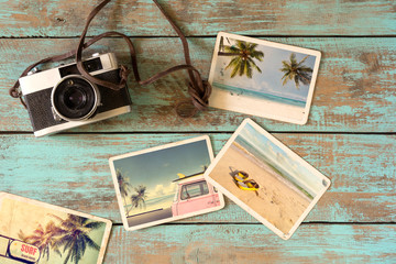 Fototapeta na wymiar Summer photo album of journey in summer surfing beach trip on wood table. instant photo of vintage film camera - vintage and retro style