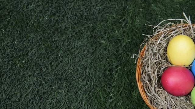 easter eggs in basket on grass
