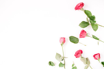 Valentines Day background. Floral pattern made of pink and beige roses, green leaves, branches on white background. Flat lay, top view. Valentine's background